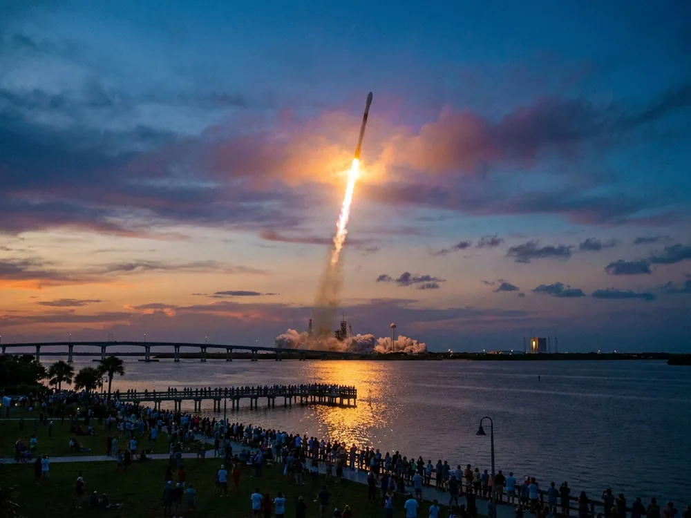 Crowd watching a rocket launch across the Indian River from Titusville