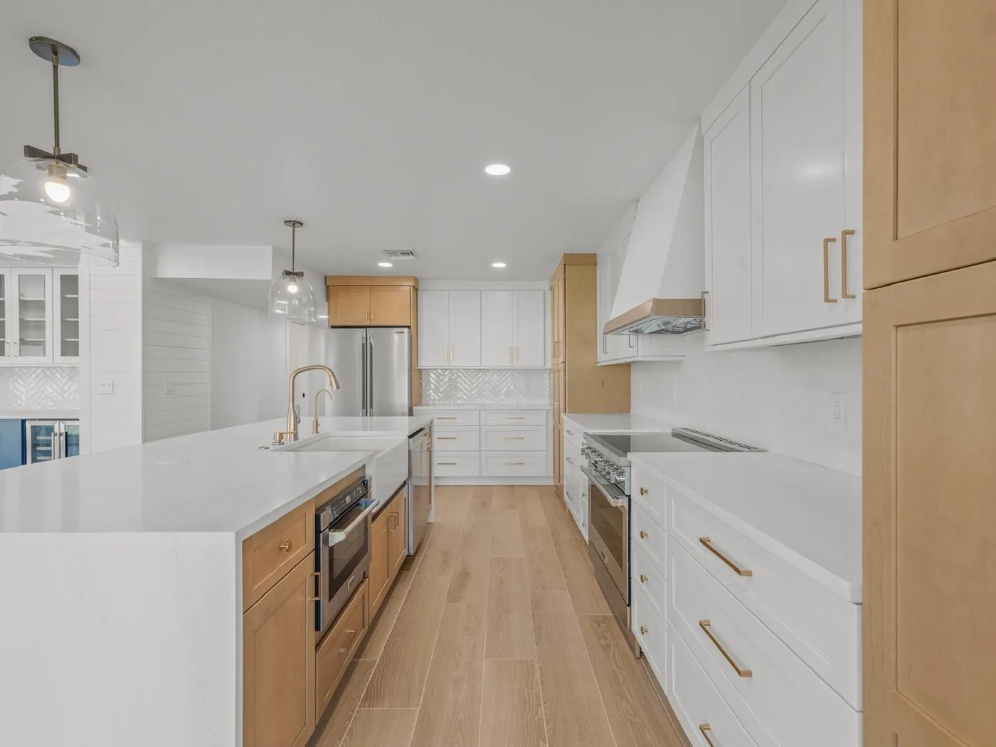 Herringbone backsplash and wood-look floor